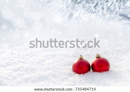Red christmas balls in the snow. Copy and paste.
