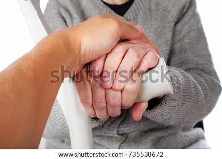 Close up picture elderly disabled woman holding a medical crutch on isolated background