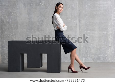 Confident asian woman achieving business success Royalty-Free Stock Photo #735551473