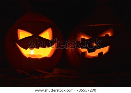 glowing halloween pumpkins in the dark