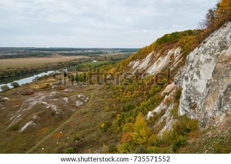 Cretaceous mountains in autumn, covered with a yellow-red colored forest. Located in Storozhevoe, Voronezh, Russia.