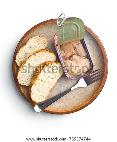 Cod liver in oil and bread isolated on white background.