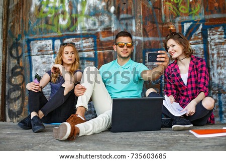 Group of students making photos with Smartphone 