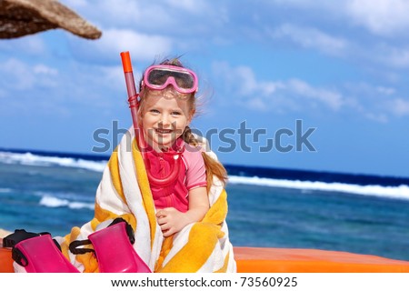 Little girl  playing on  beach.