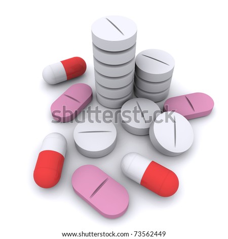 round tablets and capsules on white background