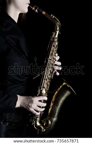 Saxophone player Saxophonist woman playing jazz music instrument. Sax player hands