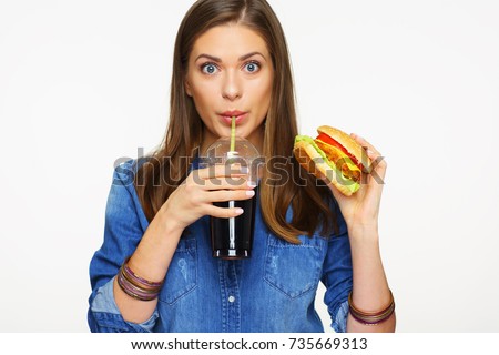 Woman drinking cola with burger. Fast food isolated on white.