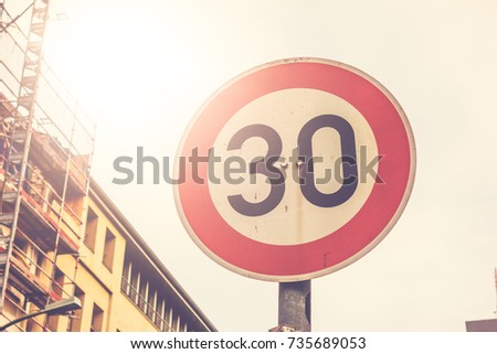 number 30 traffic limit sign in warm sunlight