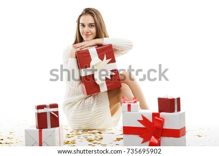 Young girl with gifts isolated on white background.