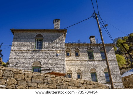 Architectural buildings in the famous Papigo village in Epirus, Greece. Papigo is a cozy, neat and tidy village with numerous beautiful pictures. It has become a popular and touristic place in Greece.