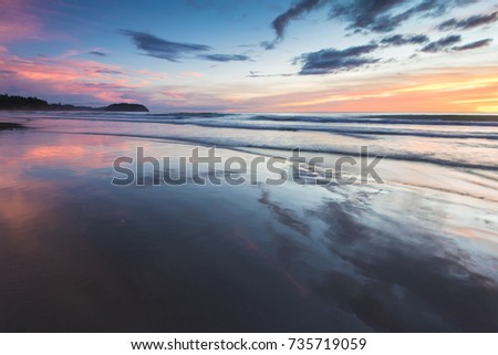 Seascape: Beautiful sunset scenery at Tip of Borneo, Kudat Sabah, North Borneo. Soft focus and motion blur due to long exposure when full resolution.