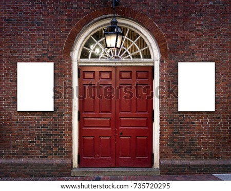 Two White Isolated Advertisement Billboard Posters on brick building with red door old