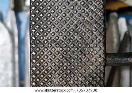 Metal pattern texture closeup of vintage linotype machine. Provost, Alberta, Canada.