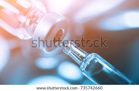 Medication drug needle syringe drug, medical Vaccine vial hypodermic injection treatment disease care in hospital and prevention illness. selective focus. Royalty-Free Stock Photo #735742660