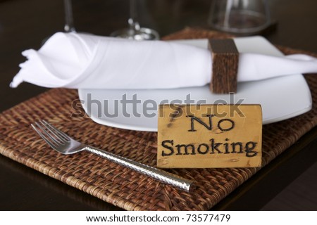 no smoking warning on dining table in restaurant or cafe