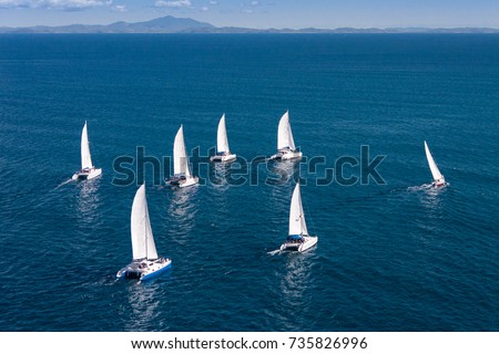 Regatta sailboat and catamaran in Mozambique Channel Royalty-Free Stock Photo #735826996