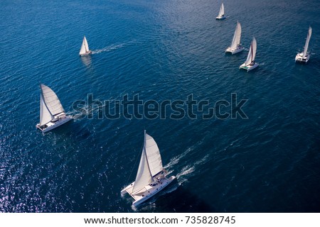 Regatta in the Indian Ocean, monohulls and catamarans Royalty-Free Stock Photo #735828745