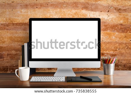 White screen computer on table and cement background