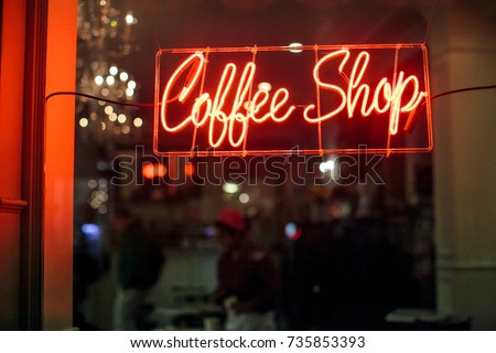 Red and orange neon coffee shop sign.  Royalty-Free Stock Photo #735853393