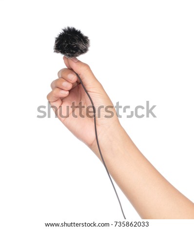 hand holding fur for microphone isolated on white background.