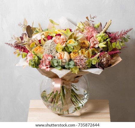 Flower composition on a gray background. Wedding and Festive decor. Bouquet from spring flowers.