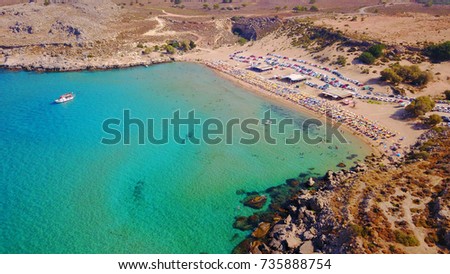 Aerial birds eye view photo taken by drone of famous beach of Agathi and Feraklos castle uphill overlooking the beach, Rhodes island, Dodecanese, Greece