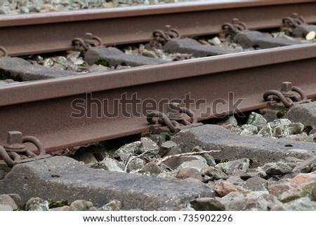 Rail with plank in the trackbed