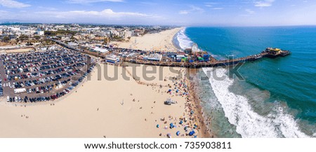 Panoramic aerial view of Santa Monica Pier, Parking and Cityscape.