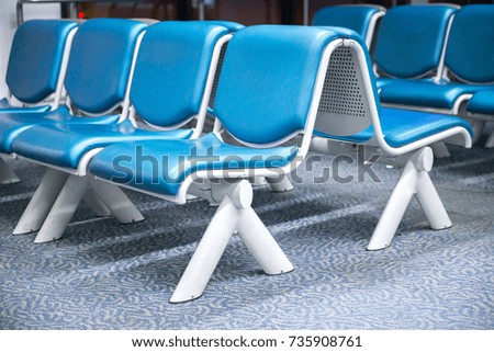 Empty seats,Blue airport seat in waiting area