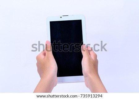 Isolated two hands holding a tablet with black screen display on white background.