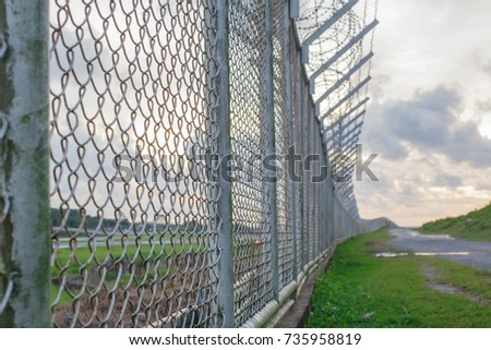 wire mesh steel with green grass background in Phuket Thailand