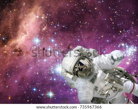 Astronaut and stars on the backdrop. The elements of this image furnished by NASA.
