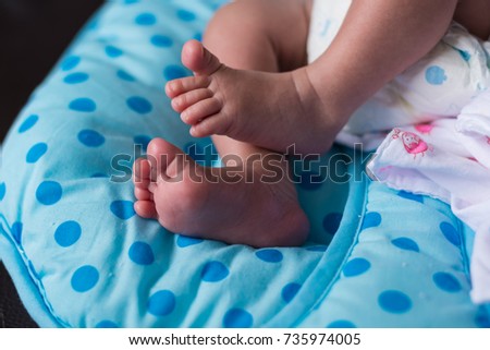 Closeup of newborn baby feet.