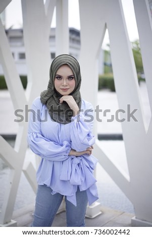 Beautiful young model in fashionable hijab style.
