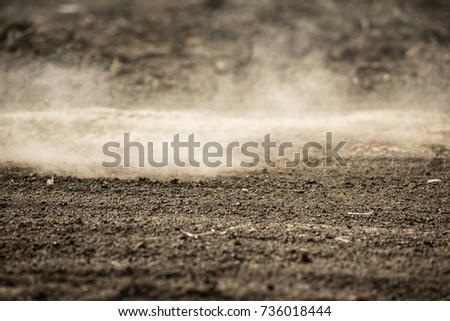 dirt fly after motocross roaring by