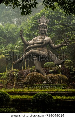 Buddha statue in Leshan in a beautiful green park, China.