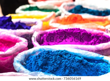 Colorful rangoli powder sold on Kathmandu street market. 