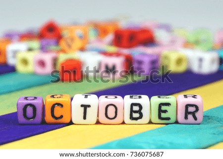 Colorful beads letter for months of the year concept - OCTOBER.