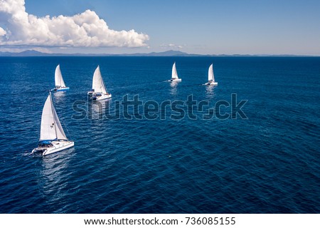 Regatta sailboat and catamaran in Mozambique Channel Royalty-Free Stock Photo #736085155