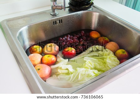 wash fresh fruit and vegetable in sink