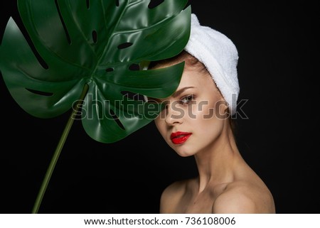 clean face skin, young woman with red lips on a black background                               