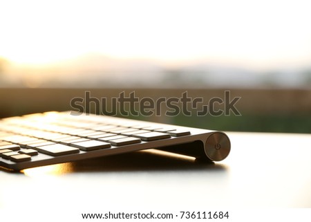 Keyboard on the table nature background

