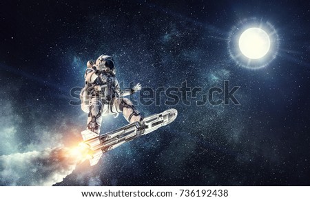 Astronaut surfing dark sky. Mixed media Royalty-Free Stock Photo #736192438