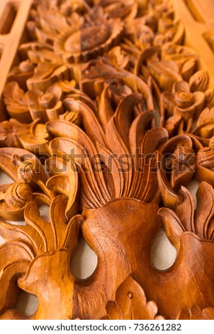 wood art panel hanged on the pillar of a modern house as an interior decoration