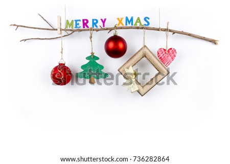 Christmas wooden thin branch with hanging toys and "Merry Xmas" greeting text written with small colorful letters on a pure white background