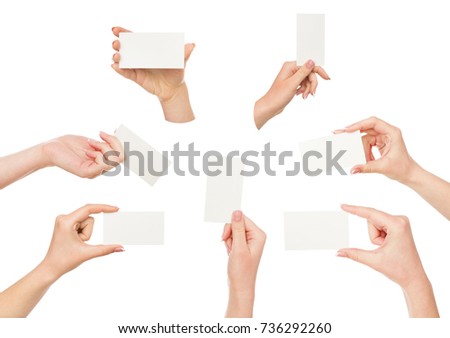 Set of white woman's hands holding white empty business cards with copy space. Isolated at white background