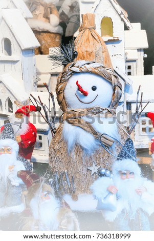 Closeup snowman at traditional christmas market holiday postcard