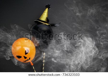 holidays, decoration and party concept - air balloons for halloween over black background.Top view