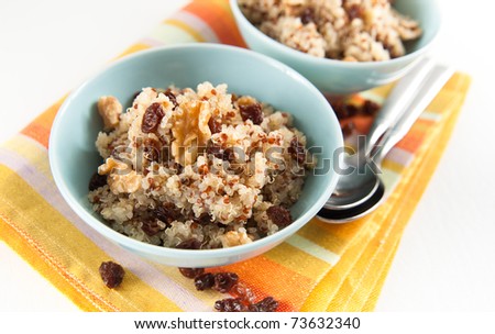 Healthy Quinoa Hot Cereal for Breakfast Served with Raisins and Walnuts