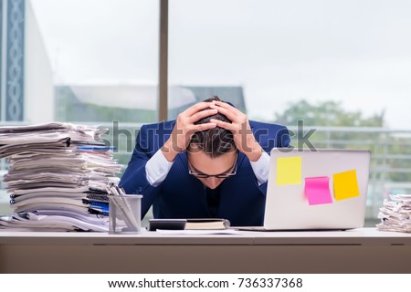 Workaholic businessman overworked with too much work in office Royalty-Free Stock Photo #736337368